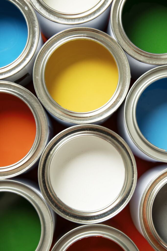 flat lay colorful paint cans arrangement