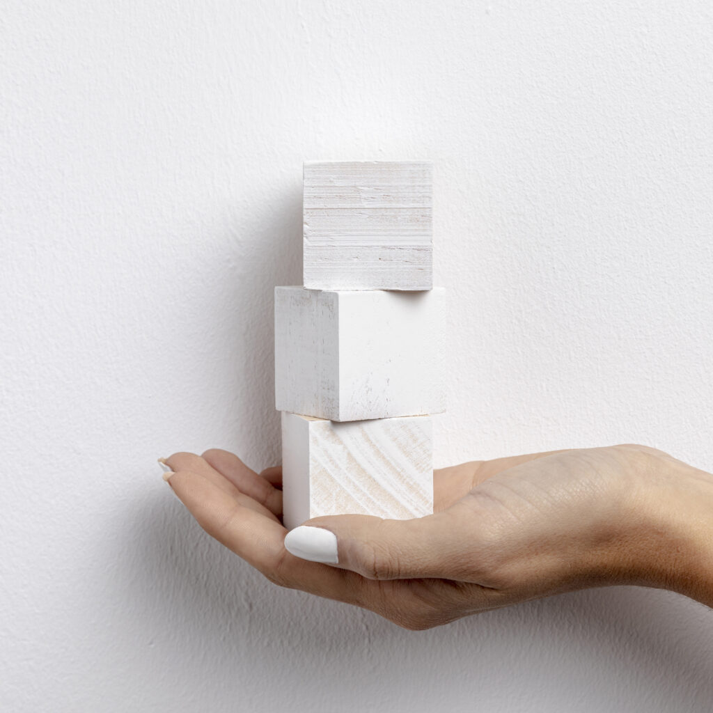 small cubes held hand